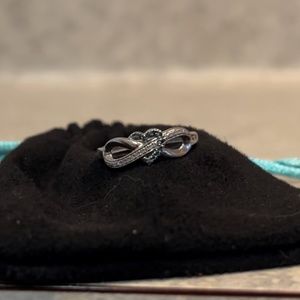 Infinity ring with diamonds and sapphire heart